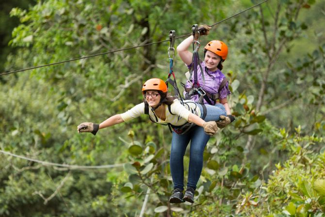 Doing the superman on a canopy tour / zip line near Arenal Volcano