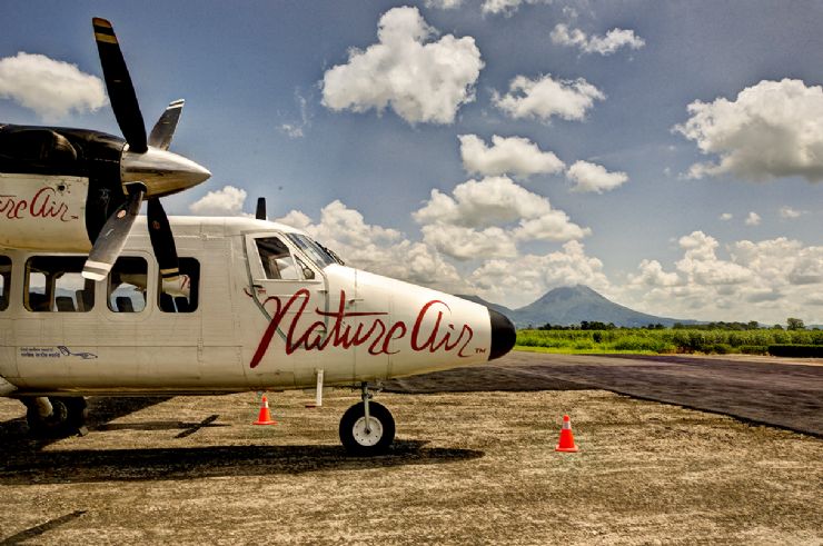 Nature Air plane with Arenal Volcano in the background