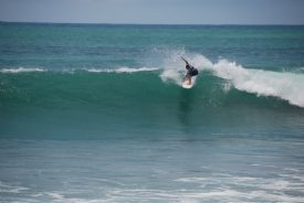 Costa Rican Surfer Droping into nice wave at Backwash Break in Matapalo
