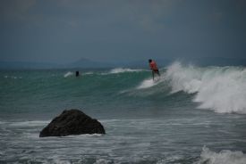 Surfer at Pan Dulce during big swell, Matapalo