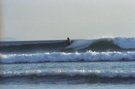 Surfer at Witches Rock (Roca Bruja)