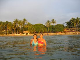 Girls swimming in Tamarindo Sunset
