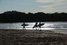 Walking to surf at Playa Langosta&nbsp;-&nbsp;Playa Langosta, Guanacaste