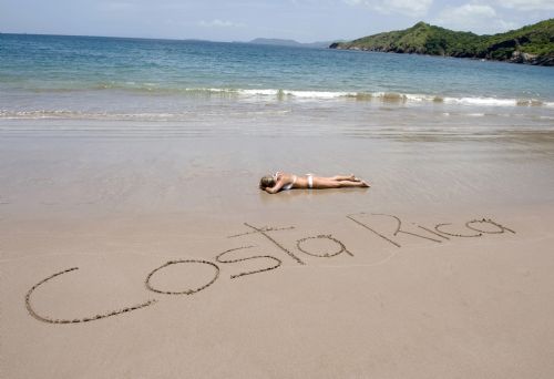 Sand letters on Jaco Beach welcomes you