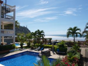 Quiet beach scene in front of La Paloma Blanca