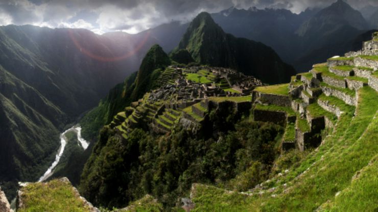 The breathtaking Machu Picchu with nearby mountain ranges in the background