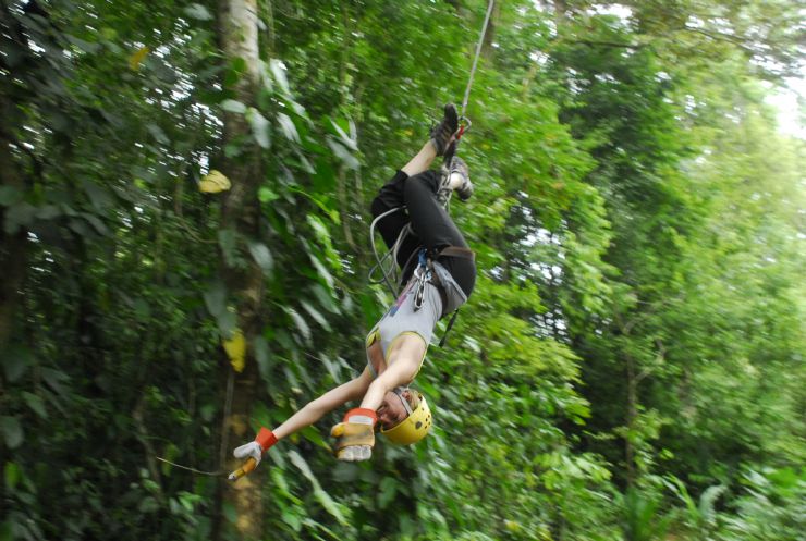 Swinging upside-down on a Canopy Tour at Colinas del Poás, Costa Rica