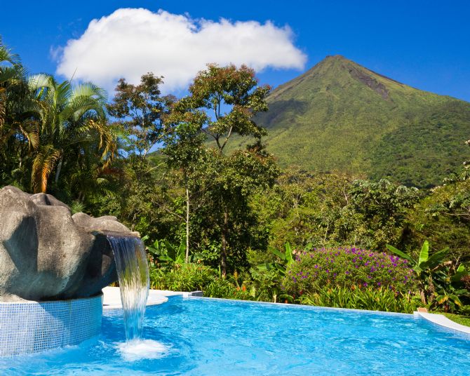 Beautiful pool at a hotel with a view of Arenal Volcano