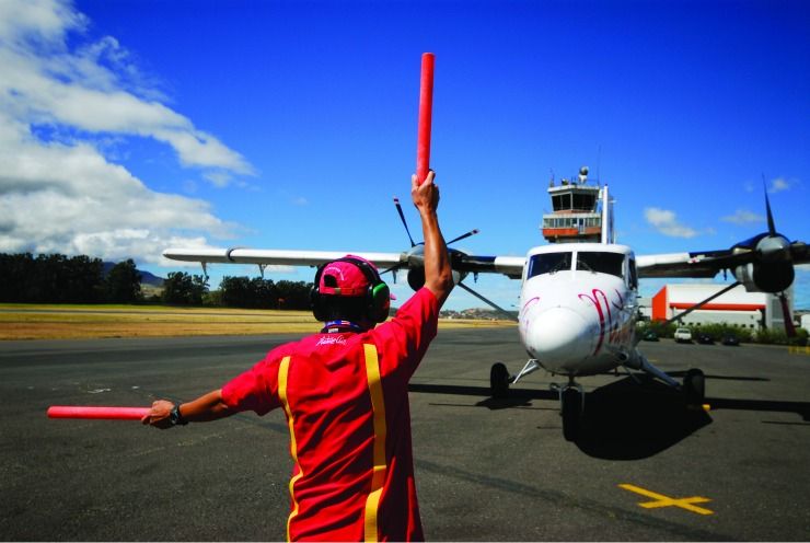 Nature Air Airplane being directed