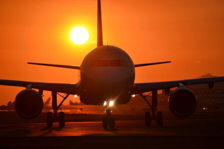 Airplane at sunset at San Jose Juan Santamaría International Airport