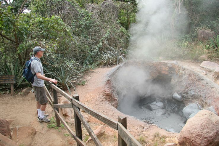 Checking out one of the many boiling mud pots in Rincon de la Vieja National Park