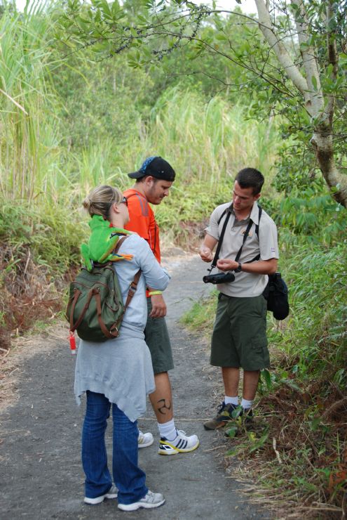 Guide explaining nature facts to tourists