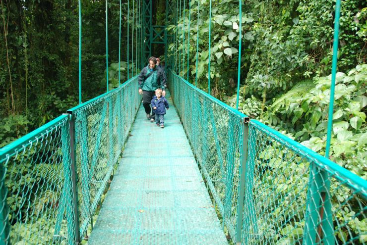 Hiking over a suspension bridge in Monteverde