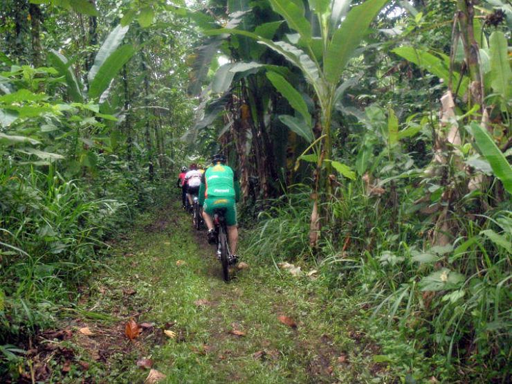 Mountain Biking through a river during Ciclismo Earth Costa Rica