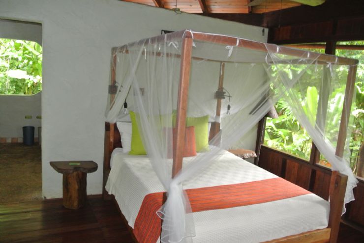 Playa Nicuesa rainforest Lodge beautiful room Bed