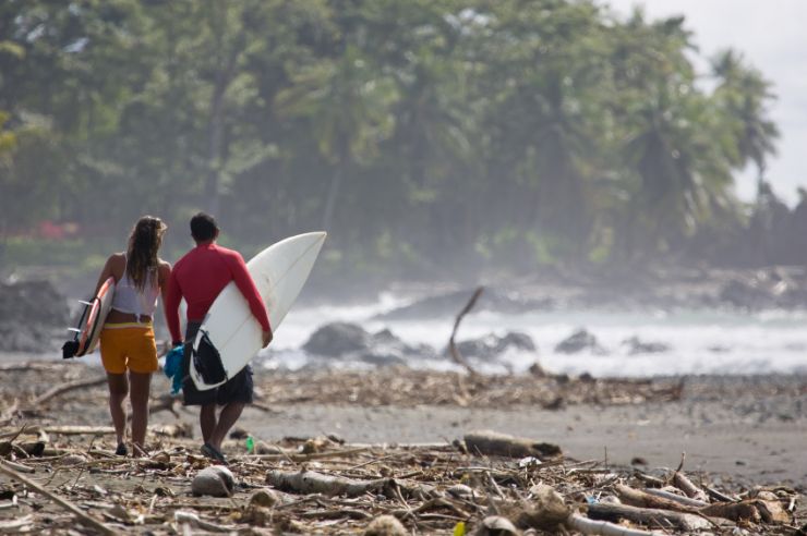 Surfers walking at Pavones