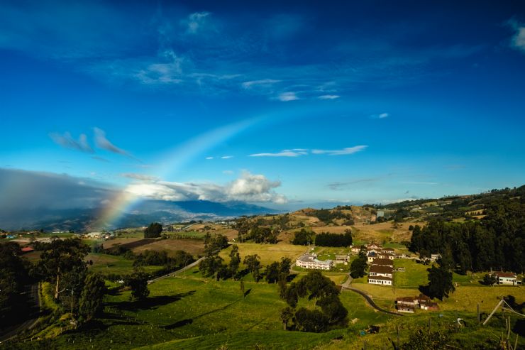 Rainbow over Sanatorio Duran looking at Irazú Volcano
