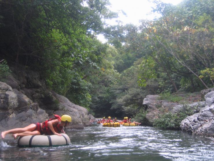 Relaxing while white water tubing