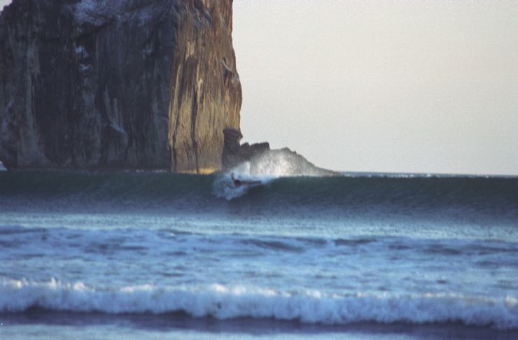 Surfer catching a wave at Witches Rock