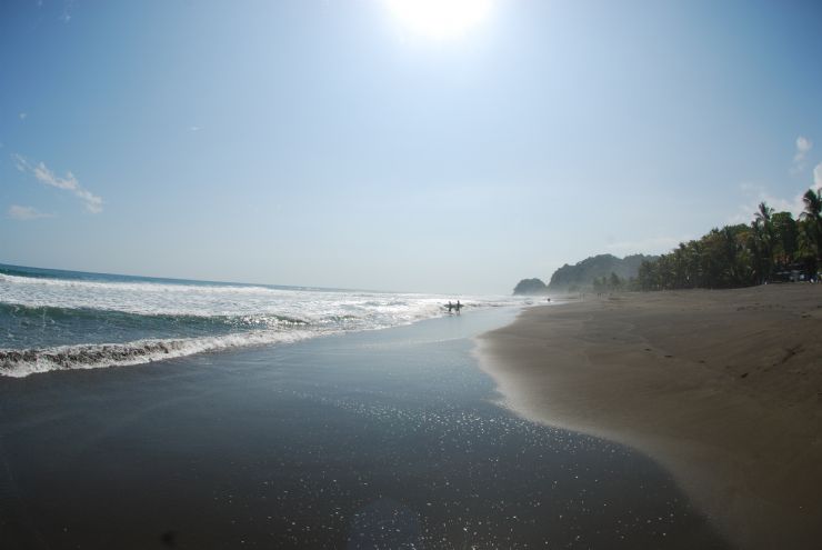 Surfers walking out at Playa Hermosa