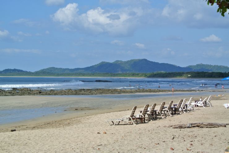 Tamarindo beach chairs waiting for you