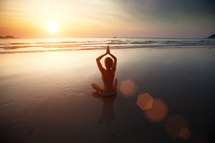 Perfect Yoga meditation on pristine beach
