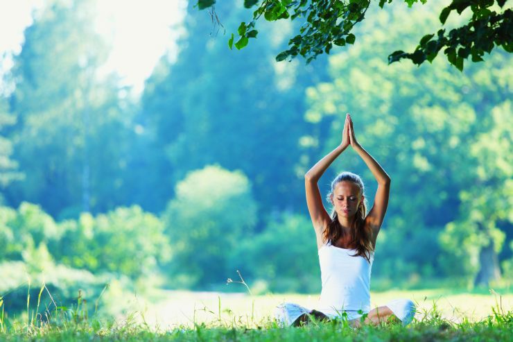 Relaxing Yoga girl on the tropical forest