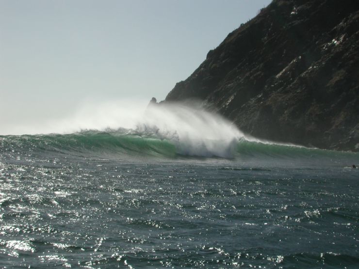 Offshore wind on a head high A-Frame wave at Ollies Point in Santa Rosa National Park