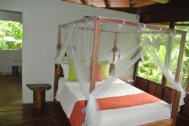 Playa Nicuesa rainforest Lodge beautiful room Bed