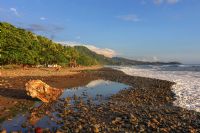 Surfers walking out to the beach at Dominical