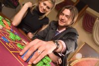 Couple playing roulette in a San Jose casino