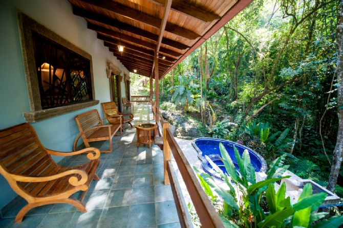 Relaxing chairs next to the pool