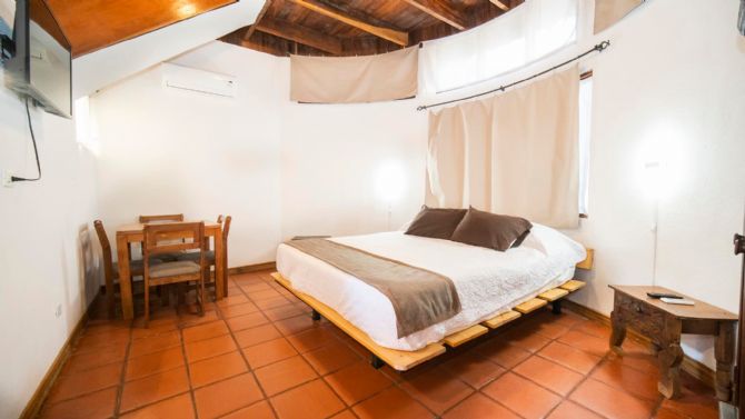 Bungalow king bed at Hotel Luna Llena Tamarindo