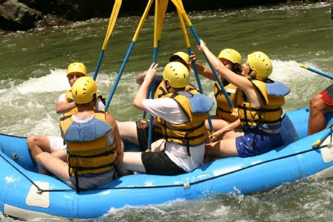 High-fiving with paddles on the Pacuare River