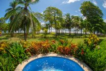 View of beach from private plunge pool at Alma Del Pacifico