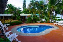 Swimming pool area at Cabinas Jimenez