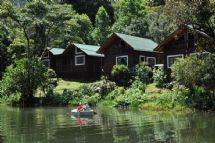 Beautiful view of Sueños del Bosque Lodge cabins and lake