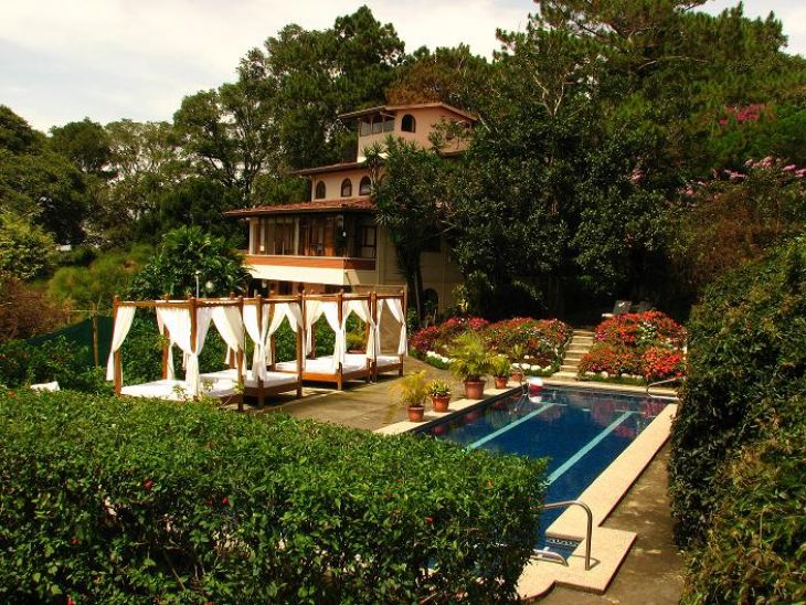 Swimming pool & view of La Catalina Hotel & Suites