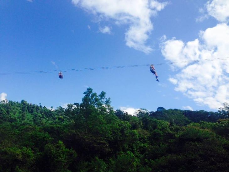 Flying above the tropical rain forest at El Santuario Canopy Adventure Tour
